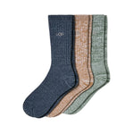 Three pairs of UGG crew socks in heathered navy blue, tan, and sage green, arranged overlapping on a white background. Available at Be Charmed