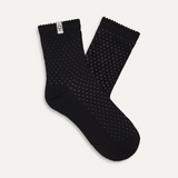 A pair of black quarter socks with a visible logo on the heel. Available at Be Charmed