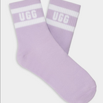 A pair of purple UGG women's socks with white stripes and the UGG logo on the ankle area. Available at Be Charmed