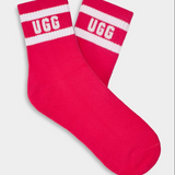 A pair of pink UGG women's socks with white stripes and the UGG logo on the ankle area. Available at Be Charmed