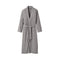 A long-sleeved UGG gray wrap robe with a matching waist tie belt, displayed on a clean, solid off-white background. Available at Be Charmed