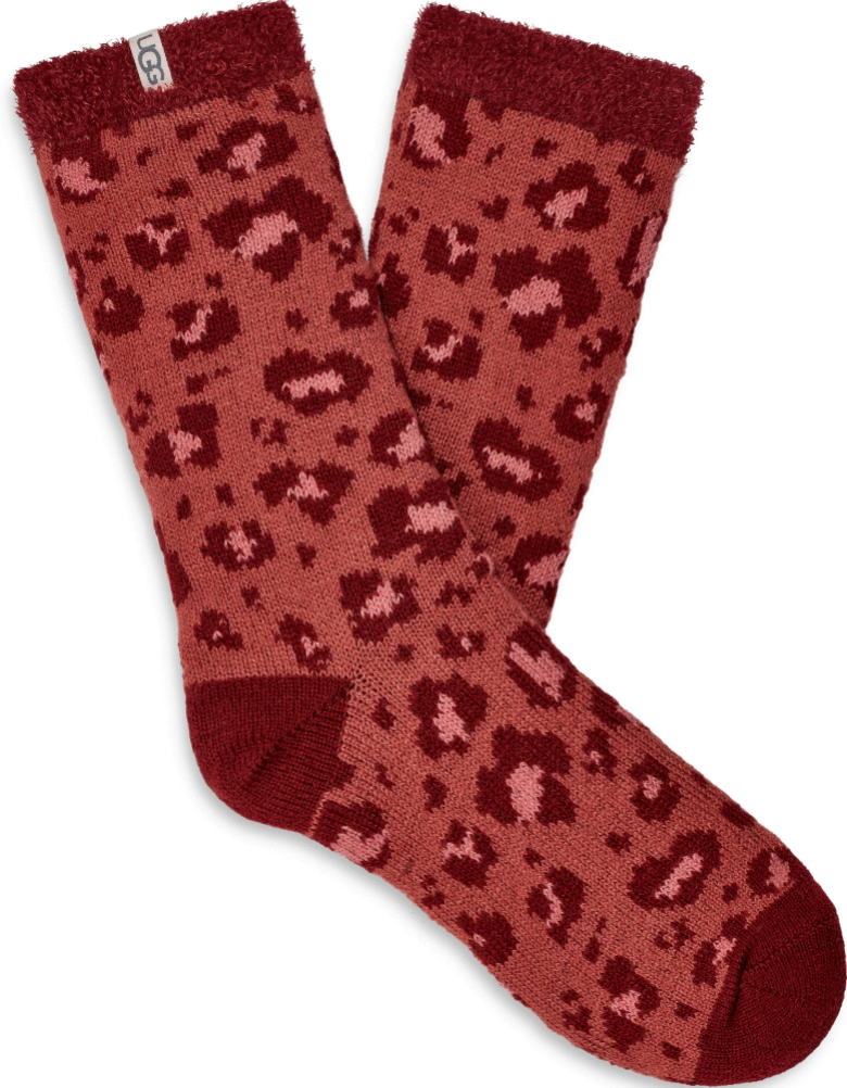 A pair of UGG women's fleece lined socks in red with a brown animal pattern. Available at Be Charmed