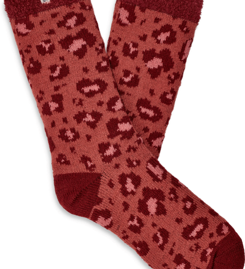 A pair of UGG women's fleece lined socks in red with a brown animal pattern. Available at Be Charmed