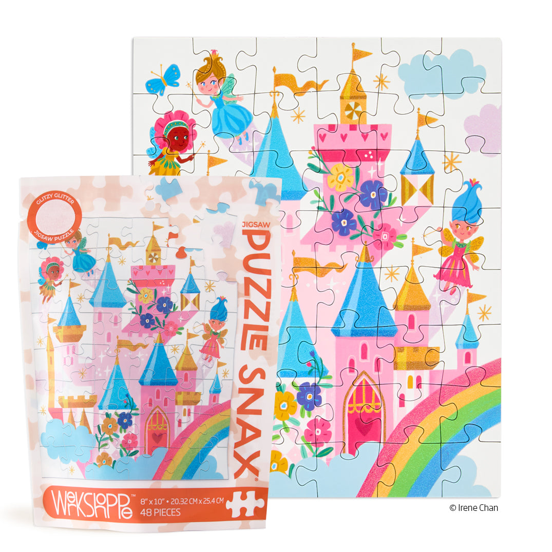 Puzzle Snax fairy tale puzzle with castle and rainbow design on a white background. Available at Be Charmed