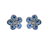 A pair of Wheeler sterling silver earrings with blue sapphire flowers and clear crystals. Available at Be Charmed