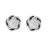 A pair of Wheeler sterling silver earrings featuring round pearl designs with a twisted silver band. Available at Be Charmed