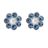 A pair of Wheeler sterling silver earrings featuring a central sapphire circle surrounded by smaller sapphire crystals, set in a clear, geometric pattern. Available at Be Charmed