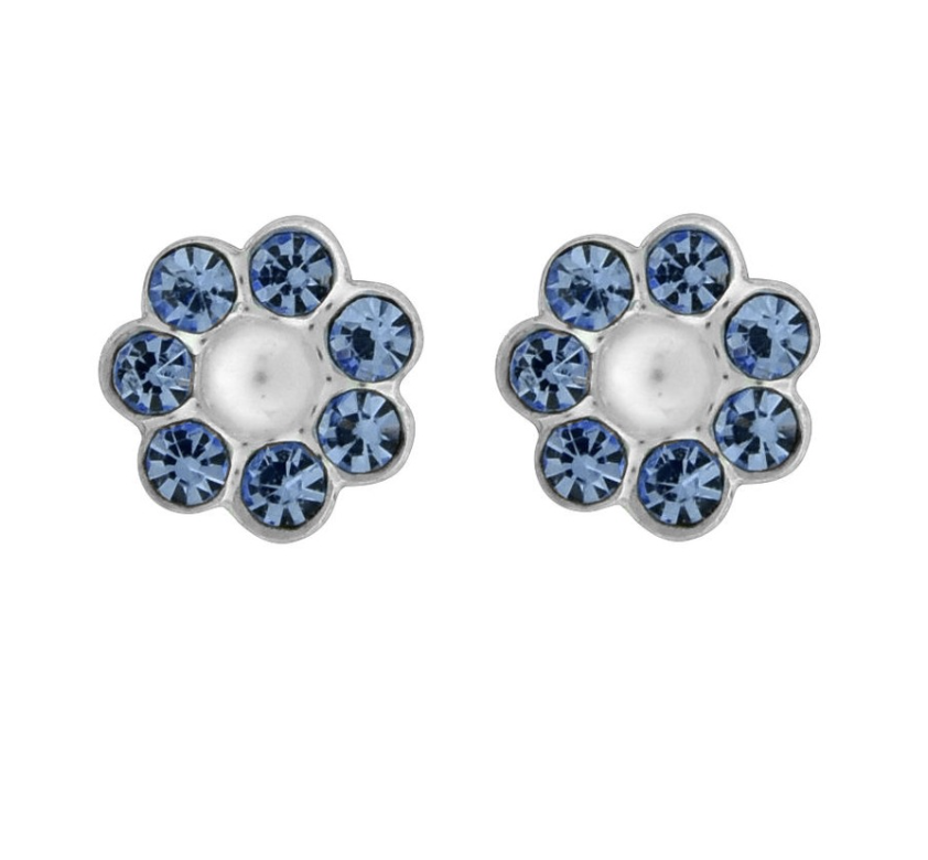 A pair of Wheeler sterling silver earrings featuring a central sapphire circle surrounded by smaller sapphire crystals, set in a clear, geometric pattern. Available at Be Charmed