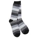 A pair of World's Softest Gem Crew socks with a geometric diamond pattern in black, gray, and white, featuring solid black heels, toes, and cuffs, displayed against a plain white background. Available at Be Charmed