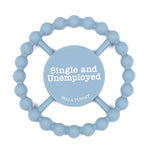 A light blue silicone Bella Tunno baby teether with a circular bead ring and a central wooden spinner disc that reads 'Single and Unemployed' with 'BELLA TUNNO' below it, on a white background. Available at Be Charmed