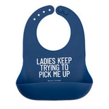 Bella Tunno Blue silicone bib with humorous text on a white background. Available at Be Charmed