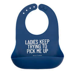 Bella Tunno Blue silicone bib with humorous text on a white background. Available at Be Charmed