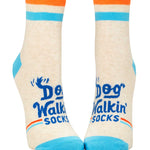 Blue Q Dog Walkin' ankle socks featuring a colorful illustrated graphic of dogs and owners, available at Be Charmed