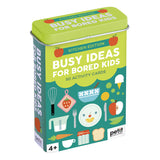 A rectangular tin box of Petit Ecoute 'Busy Ideas for Bored Kids' Kitchen Edition activity cards, featuring a bright lime green lid and a teal front decorated with colorful kitchen-themed illustrations. Available at Be Charmed