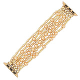 Gold beaded watch strap on a white background