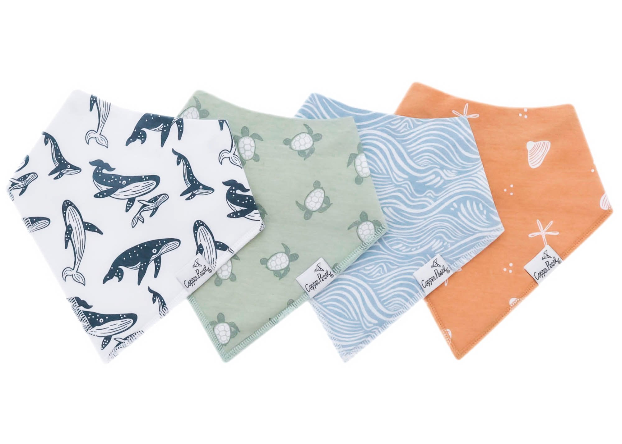 Set of four baby bibs with various patterns on a white background. Available at Be Charmed