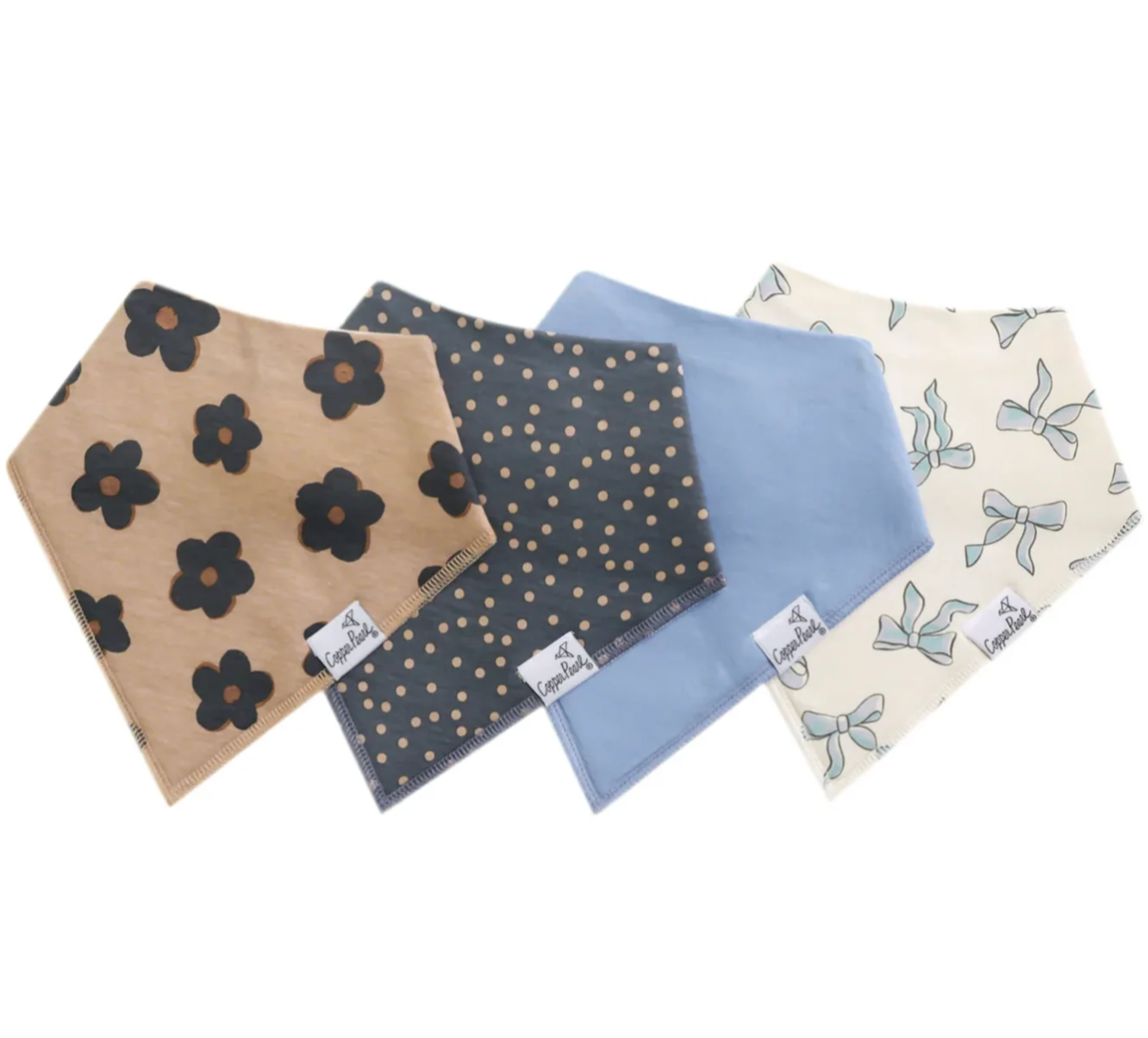 Four baby bibs with different patterns on a white background. Available at Be Charmed