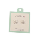 A pair of silver starfish shaped hypoallergenic surgical steel posts by the brand 'cuties', mounted on a light mint green and white display card. Available at Be Charmed