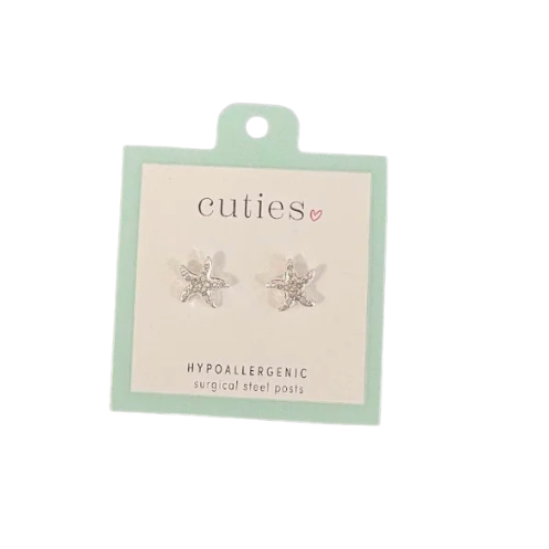 A pair of silver starfish shaped hypoallergenic surgical steel posts by the brand 'cuties', mounted on a light mint green and white display card. Available at Be Charmed
