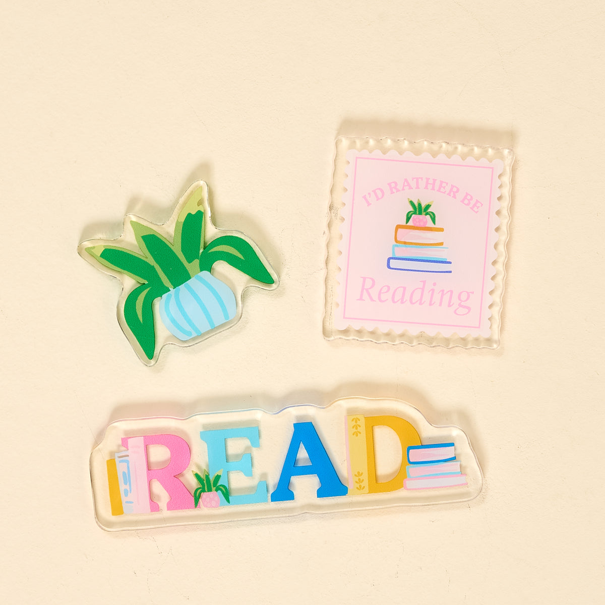 Three book themed magnets on a beige background. Available at Be Charmed