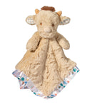 Plush snuggler with a cow design on a white background. Available at Be Charmed