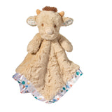 Plush snuggler with a cow design on a white background. Available at Be Charmed