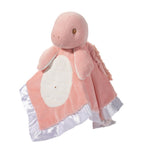 Pink plush snuggler with white ruffled trim on a white background. Available at Be Charmed