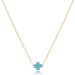 A 16-inch gold-filled chain necklace with a small turquoise signature cross pendant. Available at Be Charmed