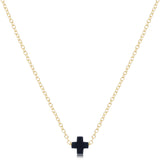 enewton Gold necklace with a navy cross pendant on a white background. Available at Be Charmed