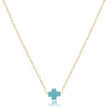 enewton Gold necklace with a turquoise cross pendant on a white background. Available at Be Charmed