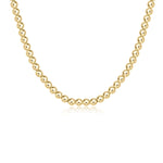 A 17-inch gold-filled choker necklace with 5mm round beads. Available at Be Charmed
