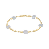 enewton Admire Small Gem 2mm Gold Bracelet with gold-filled beads and delicate aquamarine gemstone accent, stackable stretch bracelet Available at Be Charmed