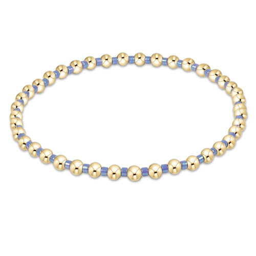 enewton Hope Grateful bracelet with bright blue beads in a symbolic gratitude pattern; vibrant, stretch-fit, and stackable. Available at Be Charmed.