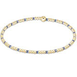 A bracelet with bright blue and gold-colored 2mm seed beads, featuring gold-filled beads. Available at Be Charmed