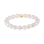 Pearl bracelet with a gold bead on a white background. Available at Be Charmed