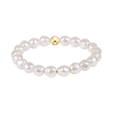 Pearl bracelet with a gold bead on a white background. Available at Be Charmed