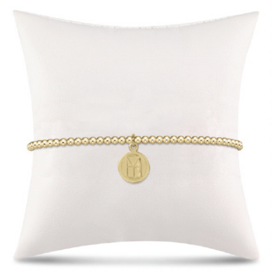 enewton Classic Gold 2.5mm Bead Bracelet featuring stretch design with “Be You” small gold disc charm. Minimalist, elegant style. Available at Be Charmed.