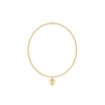 Gold bracelet with a heart-shaped charm on a white background. Available at Be Charmed