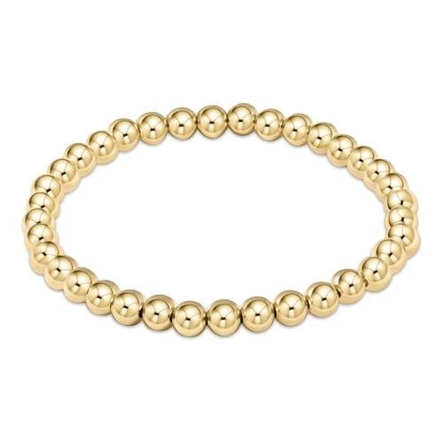 enewton Classic Gold 5mm Bead Bracelet with polished 14k gold-filled beads. Timeless, water-friendly, and stackable. Available at Be Charmed.