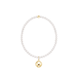 Pearl bracelet with a gold charm on a white background. Available at Be Charmed