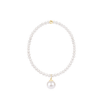 Pearl bracelet with pearl charm on a white background. Available at Be Charmed