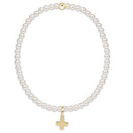 enewton Signature Cross bracelet with 3mm classic pearl beads and subtle cross detail; feminine, spiritual, and stackable. Available at Be Charmed.