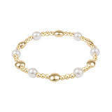 Gold and pearl bracelet on a white background. Available at Be Charmed