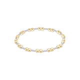 Gold and silver beaded bracelet on a white background. Available at Be Charmed
