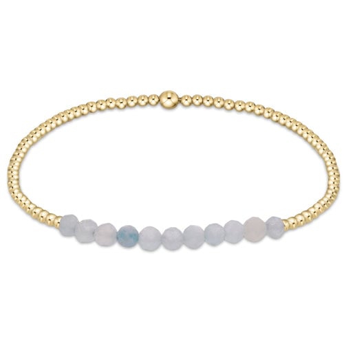 A gold-filled bracelet with aquamarine gemstone beads, featuring a lobster clasp closure. Available at Be Charmed