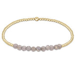 enewton Gold Bliss Bracelet with 2mm 14k gold-filled beads and faceted labradorite gemstones. Elegant, stackable, and water-friendly. Available at Be Charmed.