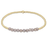 enewton Gold Bliss Bracelet with 2mm 14k gold-filled beads and faceted labradorite gemstones. Elegant, stackable, and water-friendly. Available at Be Charmed.