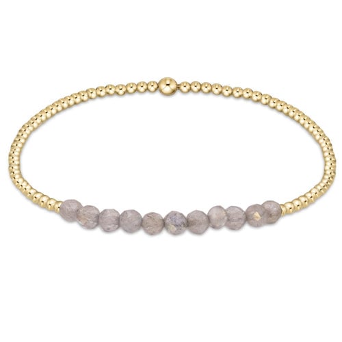 enewton Gold Bliss Bracelet with 2mm 14k gold-filled beads and faceted labradorite gemstones. Elegant, stackable, and water-friendly. Available at Be Charmed.