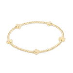 enewton Signature Cross bracelet with 2mm gold-filled beads in a small cross pattern; slim, elegant, and stackable. Available at Be Charmed.