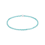 Turquoise beaded choker necklace on a white background. Available at Be Charmed